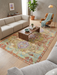 5' x 8' Rectangular Multicolor Distressed Tribal Geometric Vintage Washable Area Rug styled in a living room with neutral seating, wood furniture, and soft natural light.