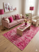 5' x 8' Rectangular Pink Distressed Oriental Vintage Area Rug styled in a chic living room with blush pink accents.