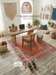 5' x 8' Rectangular Red & Blue Floral Medallion Traditional Persian Washable Area Rug styled in a home office with wooden desk and accent chair.