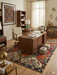 5' x 8' Rectangular Red Multi Color Geometric Floral Tribal Vintage Area Rug styled in a home office.