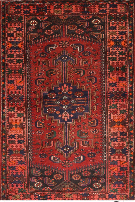 5' x 8' Rectangular Red & Navy Tribal Geometric Traditional Washable Area Rug isolated on a white background.
