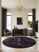 6' Round Black Plum Solid Contemporary Area Rug showcased in a sophisticated entryway with dark furnishings and moody jewel-toned accents.