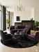 6' Round Black Plum Solid Contemporary Area Rug styled in a luxurious modern living room with deep plum seating and sleek metallic accents.