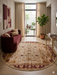 6' Round Ivory Burgundy Floral Medallion Traditional Area Rug placed in a sophisticated entryway with cream curtains and classic furnishings.