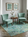 6' x 6' Square Blue Green Distressed Floral Vintage Transitional Area Rug styled in a seating area with accent chairs and botanical wall art.