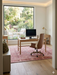 6' x 6' Square Blush Pink & Ivory Distressed Floral Traditional Area Rug styled in a home office with a desk and modern chair.