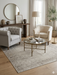 6' x 6' Square Light Gray & Ivory Distressed Medallion Traditional Area Rug styled in a living room with neutral seating and elegant accents.