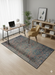 6' x 9' Rectangle Teal Blue Rust Geometric Traditional Area Rug styled in a modern home office.