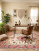 6' x 9' Rectangular Cream & Pink Floral Oriental Traditional Area Rug styled in a home office with natural wood furniture and soft lighting.