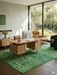 6' x 9' Rectangular Green Distressed Abstract Modern Area Rug styled in a home office with wood furniture and contemporary decor.