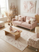 6' x 9' Rectangular Ivory & Blush Abstract Minimalist Modern Area Rug styled in a living room with a sofa, coffee table, and soft pastel accents.