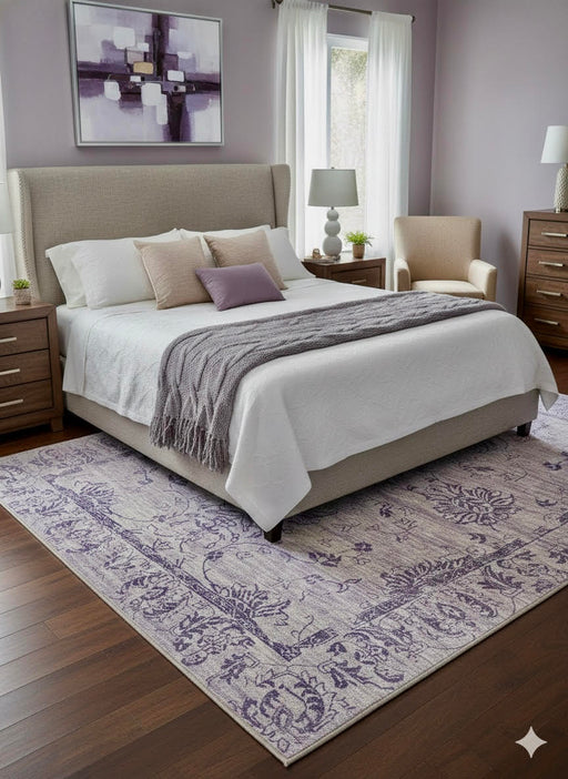 6' x 9' Rectangular Light Green & Navy Blue Botanical Floral Contemporary Washable Area Rug placed in a cozy bedroom setting.