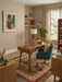 6' x 9' Rectangular Multicolor & Red Striped Tribal Traditional Area Rug styled in a cozy home office.