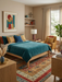6' x 9' Rectangular Multicolor & Red Striped Tribal Traditional Area Rug styled in a warm modern bedroom.