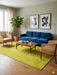 6' x 9' Rectangular Yellow Distressed Minimalist Modern Washable Area Rug styled in a living room with a sofa and coffee table.