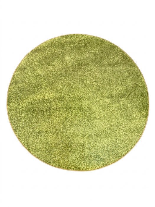 7 ft Round Green Solid Shag Modern Contemporary Area Rug isolated on a white background.