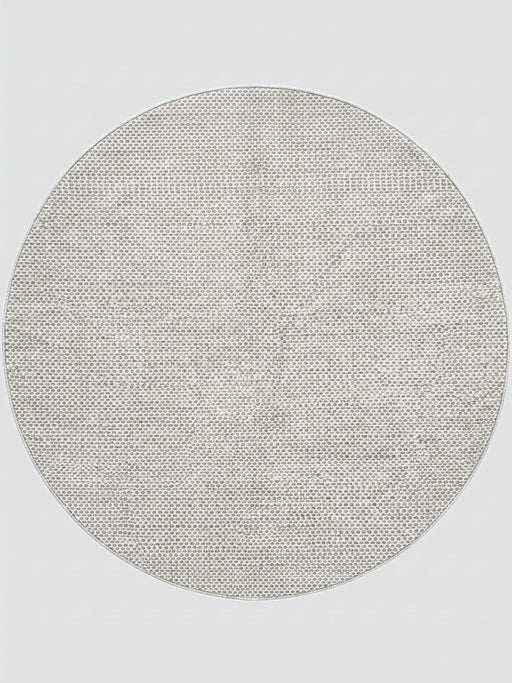 7' round ivory gray micro dot textured modern area rug isolated on a white background.