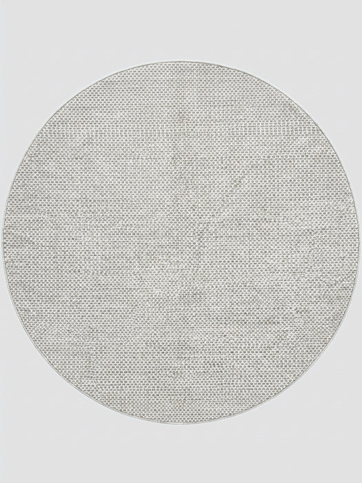 7' round ivory gray micro dot textured modern area rug isolated on a white background.