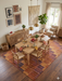 7' x 10' Rectangular Brown & Rust Checkered Geometric Modern Washable Area Rug styled in a dining room with wood furniture and warm natural light.