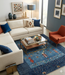 7' x 10' Rectangular Gray & Blue Solid Textured Modern Area Rug styled in a contemporary living room.