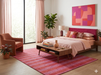 7' x 10' Rectangular Red Pink Striped Contemporary Area Rug placed beneath a bed in a chic contemporary bedroom.