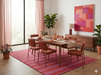 7' x 10' Rectangular Red Pink Striped Contemporary Area Rug styled under a dining table in a modern dining room.