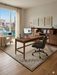 7' x 7' Square Beige & Gray Geometric Border Modern Area Rug styled in a home office with a wooden desk and city view.