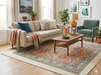 7' x 7' Square Coral & Blue Distressed Floral Vintage Area Rug styled in a bright living room.