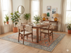7' x 7' Square Coral & Blue Distressed Floral Vintage Area Rug styled under a dining table in a warm dining room.