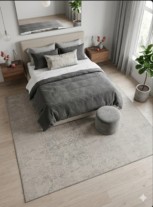 7' x 7' Square Ivory & Gray Distressed Abstract Modern Area Rug placed beneath a modern bed in a serene bedroom.