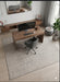 7' x 7' Square Ivory & Gray Distressed Abstract Modern Area Rug styled in a minimalist home office.