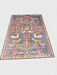 7' x 9' Rectangle Charcoal Gray & Rust Folk Tribal Washable Area Rug displayed on a studio background highlighting the folk-inspired animal and geometric pattern.