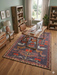 7' x 9' Rectangle Charcoal Gray & Rust Folk Tribal Washable Area Rug styled in a modern home office with wooden desk and bookshelves.