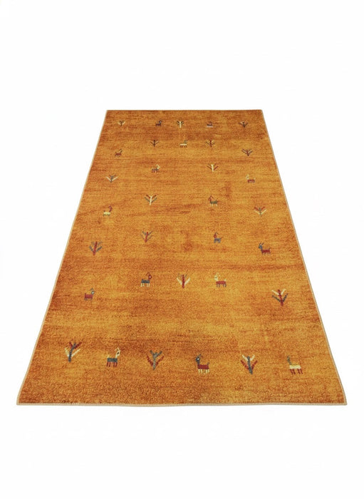 7' x 9' Rectangular Gold Camel Animal Tribal Southwestern Area Rug isolated on a white background.