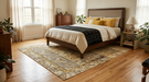 7' x 9' Rectangular Ivory & Gold Tribal Geometric Traditional Area Rug featuring an intricate tribal-inspired geometric pattern with ivory, gold, and black accents.