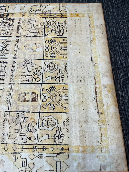 7' x 9' Rectangular Ivory & Gold Tribal Geometric Traditional Area Rug isolated on a white background.