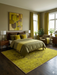 7' x 9' Rectangular Mustard Gold & Brown Distressed Medallion Traditional Washable Area Rug styled in a contemporary bedroom under a neatly made bed.