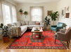7' x 9' Rectangular Red & Charcoal Tribal Geometric Southwestern Area Rug styled in a bright living room.