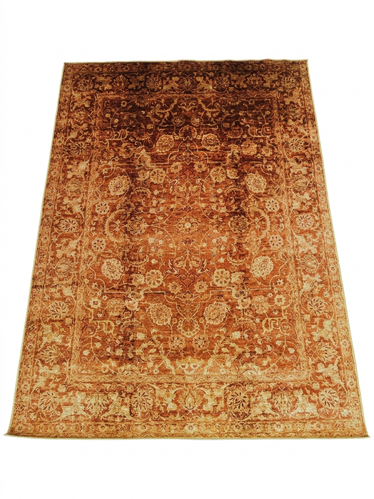 7' x 9' Rectangular Rust Gold Distressed Floral Medallion Vintage Traditional Area Rug isolated on a white background.