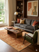 7' x 9' Rectangular Rust Gold Distressed Floral Medallion Vintage Traditional Area Rug styled in a living room with neutral seating and warm wood accents.