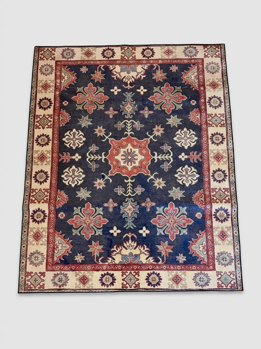 7' x 9' rectangular navy blue & red floral medallion traditional area rug isolated on a white background.