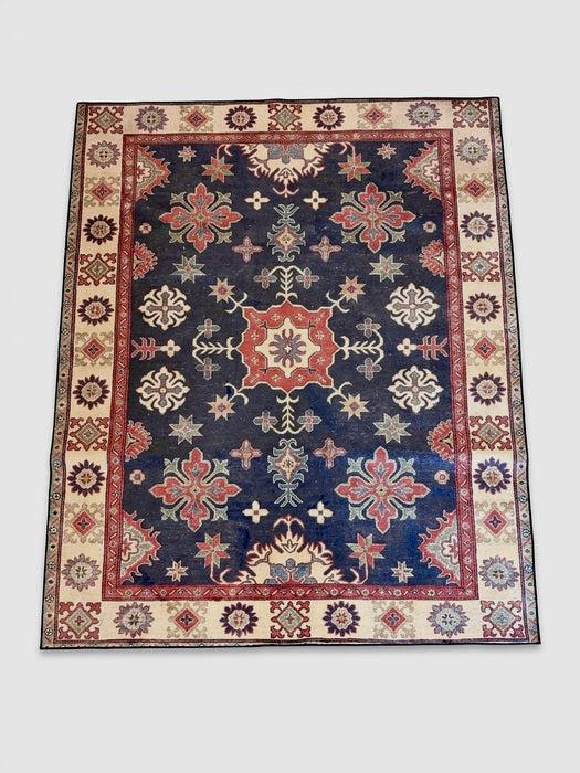 7' x 9' rectangular navy blue & red floral medallion traditional area rug isolated on a white background.