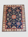 7' x 9' rectangular navy blue & red floral medallion traditional area rug isolated on a white background.