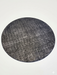 8' Round Charcoal Gray Textured Abstract Modern Washable Area Rug isolated on a white background.
