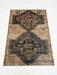 8' x 10' Rectangular Beige & Charcoal Tribal Medallion Vintage Area Rug isolated on a white background.