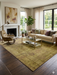 8' x 10' Rectangular Olive Gold & Purple Distressed Vintage Traditional Area Rug styled in a living room with neutral seating and warm wood tones.