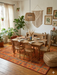 8' x 10' Rectangular Orange & Green Tree Motif Traditional Vintage Washable Area Rug styled in a bohemian dining room.