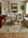 8' x 10' Rectangular Sage Green Multicolor Floral Traditional Washable Area Rug styled in a living room with neutral sofas, accent chairs, and natural light.