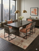8' x 12' Rectangular Ivory Beige Distressed Abstract Modern Area Rug styled in a dining room.