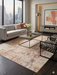 8' x 12' Rectangular Ivory Beige Distressed Abstract Modern Area Rug styled in a living room.